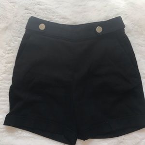 Black trouser short with gold button detail